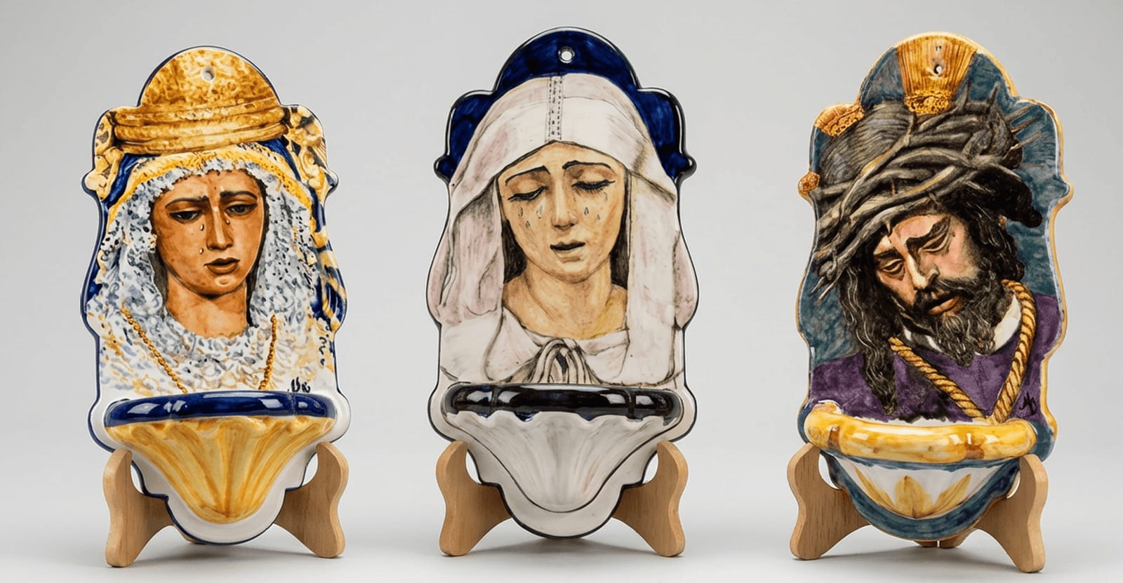 Hand-painted ceramic holy water fonts with religious motifs
